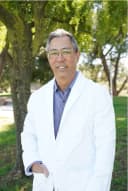 Dr. Charles Arita