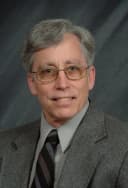 Dr. Charles Oster